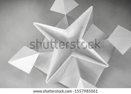 origami of white paper light and shadow