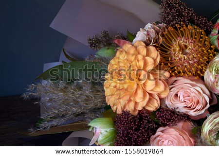 Close-up bouquet decorated in vintage style on a dark background, selective focus