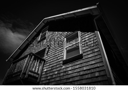 A low angle shot of an old house.