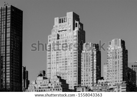 black and white photo of vintage skyscrapers along 15 central park avenue in New York, NY, United States