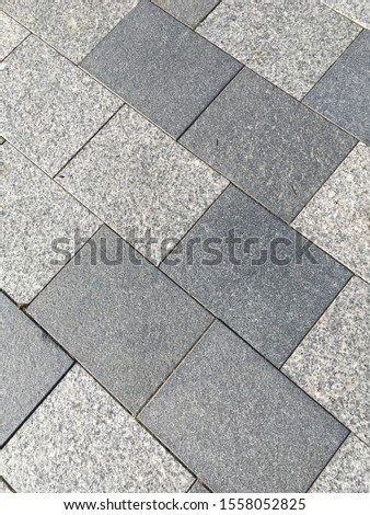Diagonal paving stones in shades of gray