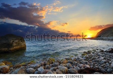 Rocks and sea. Dramatic scene. Composition of nature.
