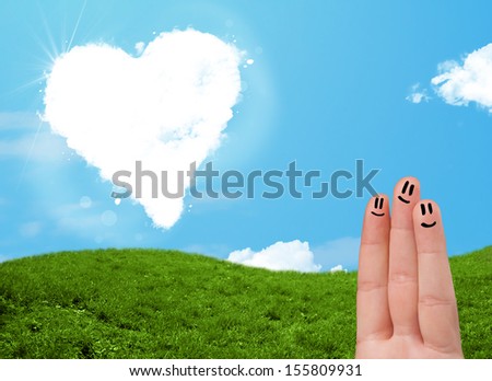 Happy cheerful smiley fingers looking at heart shaped cloud