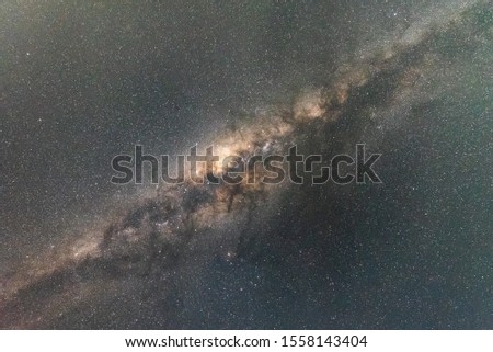 Milky Way Galaxy in clear night sky.The Milky Way is is a barred spiral galaxy with large group of stars that contain solar system.