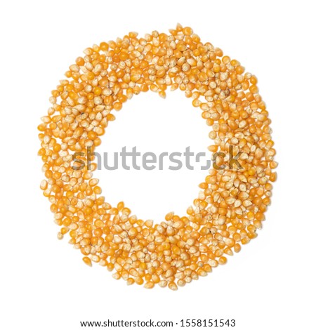 Letter O of the English alphabet from from yellow dry corn  on a white isolated background. Food pattern made from corn. bright alphabet for shops. cereal for corn porridge