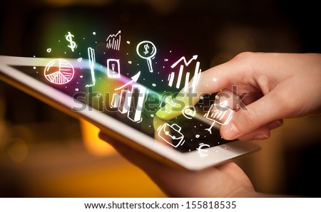 Finger pointing on tablet pc, charts concept Royalty-Free Stock Photo #155818535