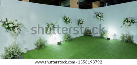 Scene for attaching pictures ,white flower  backdrop for wedding ,white  floral and green leaf background