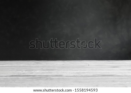 background with wooden table and dark wall