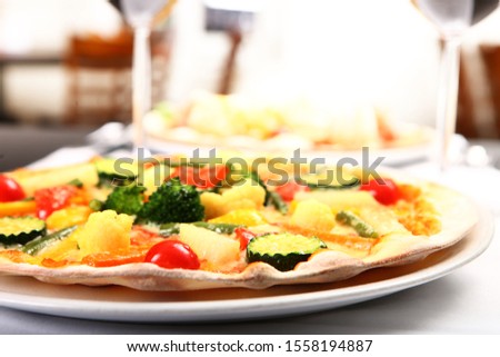 Pizza with tomato, meat and ananas toppings