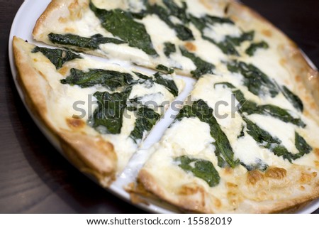 A Turkish style Mixed cheese and spinach pizza