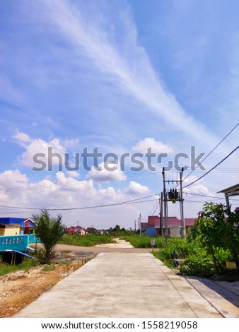 Views of comfortable resident's houses with Dramatic Clouds and Blue Sky in The Morning.