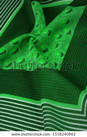 Textural pattern, collection, silk fabric, green background with a striped pattern of white and salad lines, Spanish theme, Mexican costumes poncho