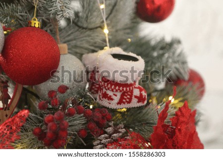 red shoe hanging on a christmas tree
