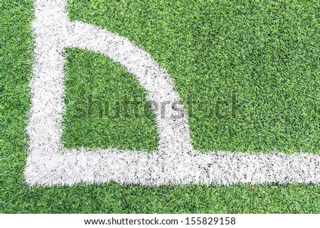 Football or soccer field corner with white marks