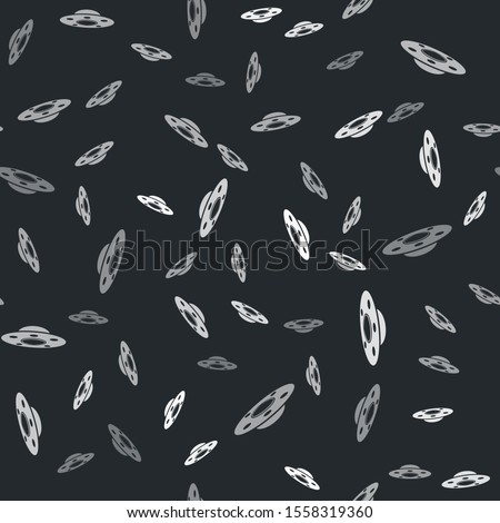 Grey UFO flying spaceship icon isolated seamless pattern on black background. Flying saucer. Alien space ship. Futuristic unknown flying object.  Vector Illustration