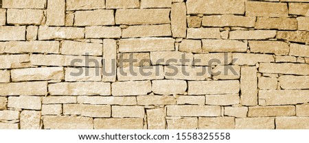 stone wall in beige as background, texture and banner