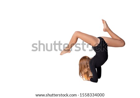 girl gymnast trains on white background. children's professional sports. rhythmic gymnastics. 