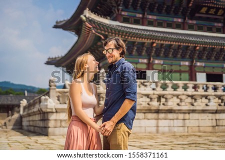 Young couple of spouses, a bride and groom, a husband and wife, boyfriend and girlfriend spend time in Korea. Holidays in Korea. Honeymoon, travel to Korea concept