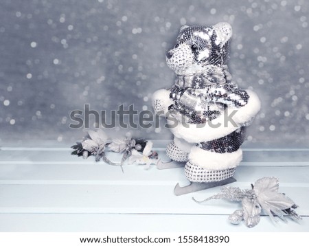 winter christmas background with bear decor snow on blue wooden texture                              