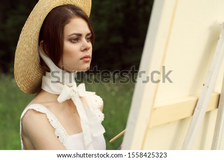 young woman in a beautiful straw hat