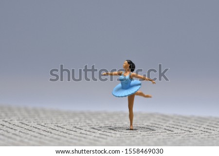 Tiny ballerina in blue tutu balancing Mini figure