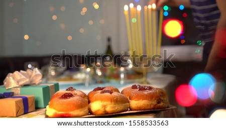 Jewish Festival of Lights. Blessings are recited when lighting the candles, which are held in a nine-branched menorah (also called a hanukkiyah)