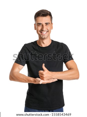 Young deaf mute man using sign language on white background Royalty-Free Stock Photo #1558543469
