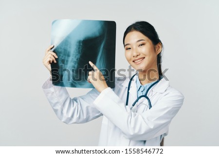 Cheerful female doctor diagnosis laboratory patient treatment x-ray