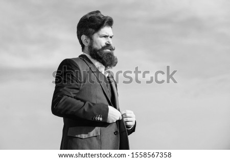 Beard fashion trend. Start with grooming routine and ultimately lead better world. Man bearded hipster wear formal suit blue sky background. Vintage style beard. Facial hair beard and mustache care.