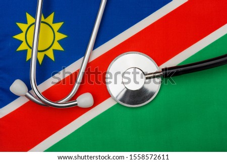 Namibia flag and stethoscope. The concept of medicine. Stethoscope on the flag in the background.