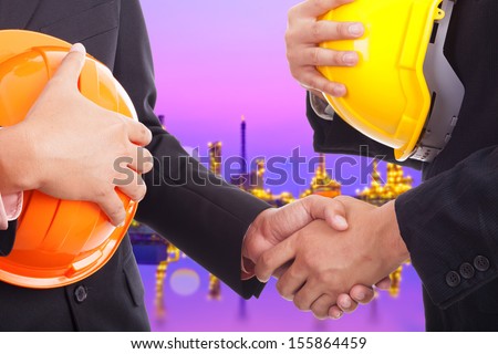 Business handshake deal refinery.