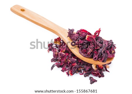 Dried hibiscus tea on wooden spoon on white background