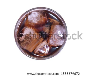 A cola glass with ice top view on white isolated background and copy space 