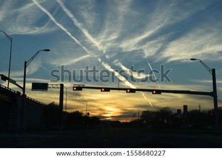 Picture of sunset behind traffic light