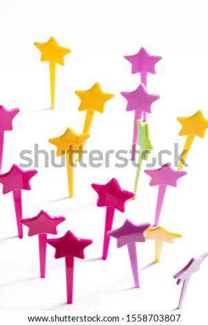 Plastic star shaped skewers isolated on white background. 