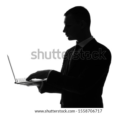 Silhouette of handsome businessman with laptop on white background Royalty-Free Stock Photo #1558706717
