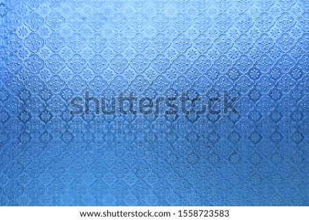 Blue color of glass with flower pattern, 
Antique glass for background