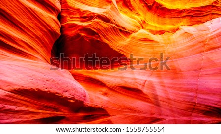 The smooth curved Red Sandstone walls caused by water erosion in Mountain Sheep Canyon. Mountain Sheep Canyon is one of the famous Slot Canyons in the Navajo lands near Page Arizona, United States