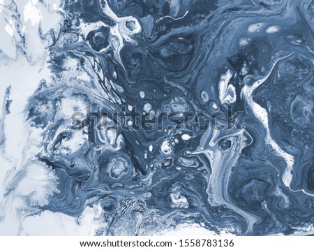 Fluid art abstract background. Blue tinted water paint splash on a canvas. Blue tinted. Monochrome picture. Marble like texture backdrop. Acrylic painted pattern.