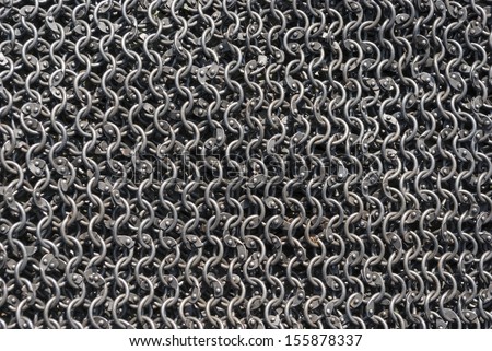 Background from metal rings, chainmail Royalty-Free Stock Photo #155878337