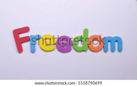 Word "Freedom" written with color sponge