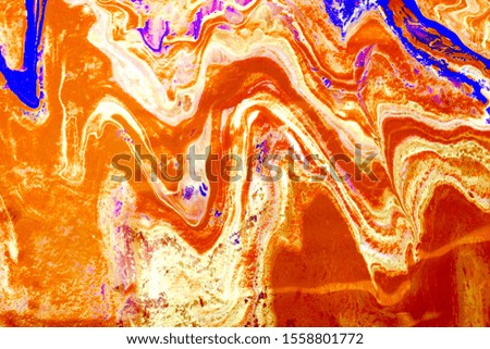 Abstract colorful liquid marble pattern texture. Fluid art. Multi color of acrylic and oil paint mixed. orange tone background