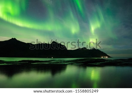 This is a picture from northern Norway showing the northern lights on the Lofoten islands.