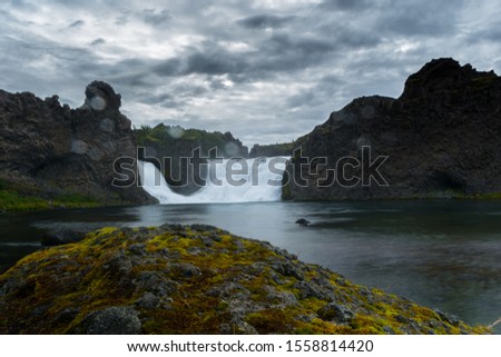 This is a picture of the breathtaking Icelandic landscape showing a watferall.
