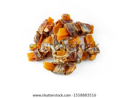 Dog treats, sweet potato and dried meat twists on white background. Natural ingredients no additives and grain free treats for pets.