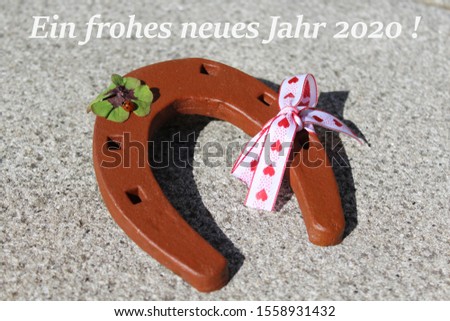 horseshoe and the german text a happy new year