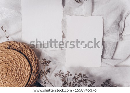 Festive wedding, birthday table setting with cards, dry branches. Blank card mockup. Restaurant menu concept. Flat lay, top view