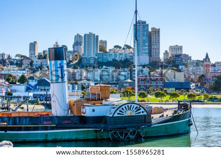 View of the San Francisco Bay with an old wheeled ship in the foreground