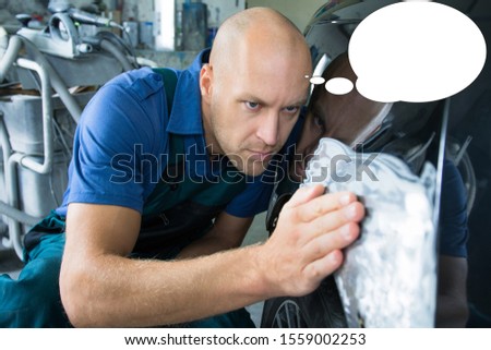 Funny picture with bubble idea bodyworker repair the car bodywork in the car shop.