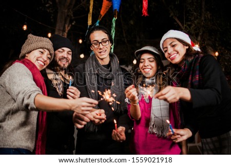Mexican Posada group of friends Singing carols in Christmas Mexico